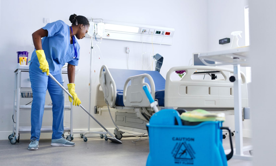 Person using professional cleaning tools to maintain a medical facility or healthcare network