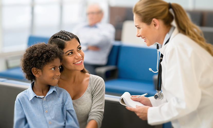 Urgent health care cleaning ensuring safety of mother and son being talked to by a doctor.