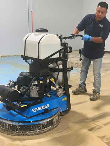 Commercial cleaning corp polishing a floor with the machine Azteck floor polishing machine