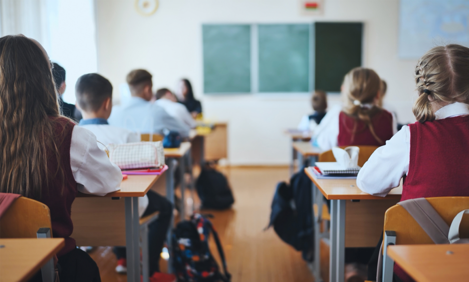 Private school students in a classroom seated at desks